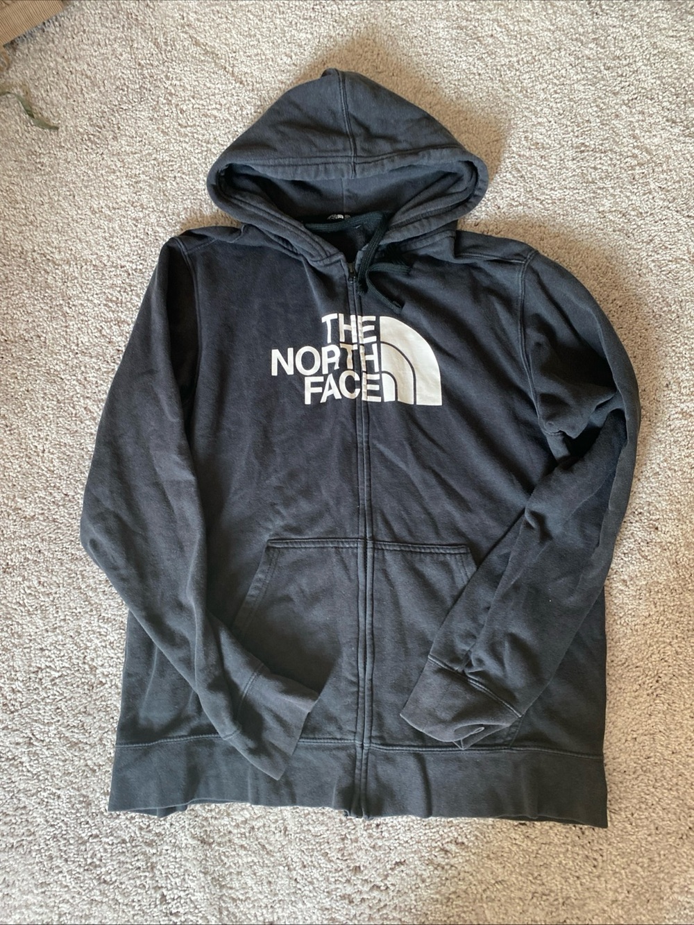 The north face zipped up hoodie black half dorm logo large
